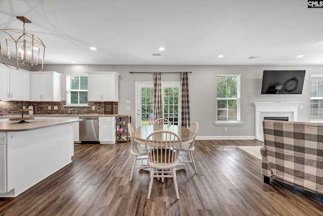 556 Harbour Pointe Dr, Columbia, SC 29229 - kitchen featuring dishwasher, open floor plan, dark wood finished floors, white cabinetry, and decorative backsplash
