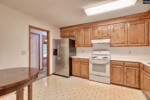 519 Cockspur Rd, Irmo, SC 29063 - kitchen featuring white range with electric stovetop, under cabinet range hood, stainless steel fridge, light countertops, and light flooring