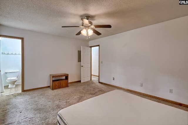 519 Cockspur Rd, Irmo, SC 29063 - unfurnished bedroom with light carpet, baseboards, a textured ceiling, ensuite bath, and a ceiling fan