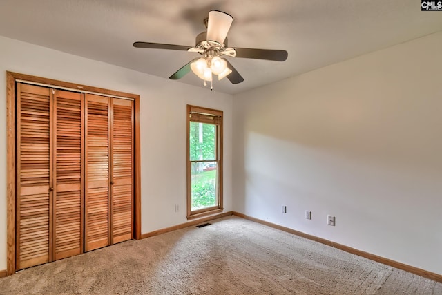 519 Cockspur Rd, Irmo, SC 29063 - unfurnished bedroom with baseboards, carpet, a closet, and a ceiling fan