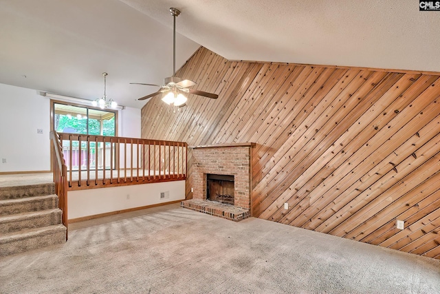 519 Cockspur Rd, Irmo, SC 29063 - unfurnished living room featuring carpet, ceiling fan, wood walls, a fireplace, and stairs