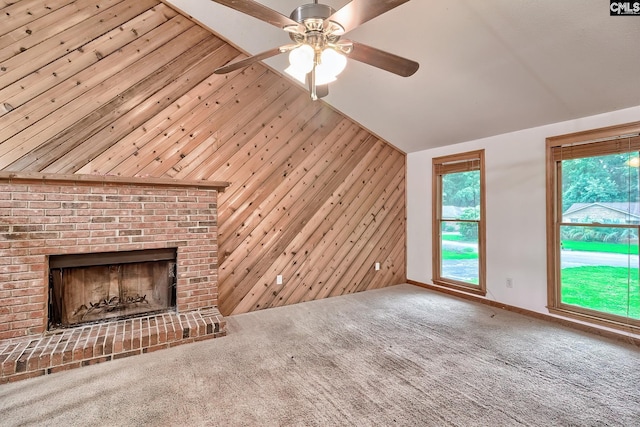 519 Cockspur Rd, Irmo, SC 29063 - unfurnished living room with a ceiling fan, lofted ceiling, wooden walls, carpet floors, and a fireplace