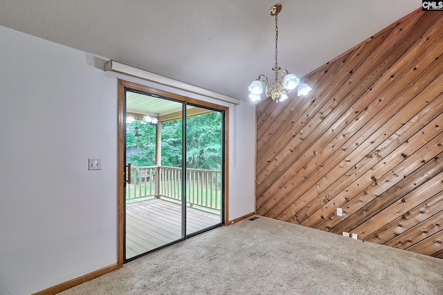 519 Cockspur Rd, Irmo, SC 29063 - spare room with carpet floors, baseboards, and a chandelier