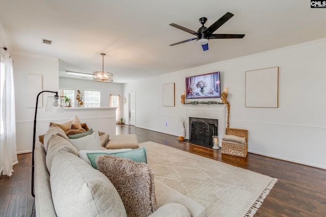 19 Yearling Ct, Irmo, SC 29063 - living area with dark wood-style flooring, crown molding, a ceiling fan, a fireplace with flush hearth, and baseboards