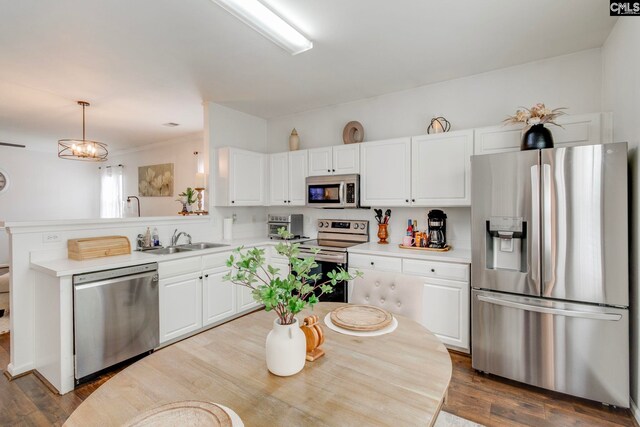 19 Yearling Ct, Irmo, SC 29063 - kitchen featuring stainless steel appliances, a sink, white cabinets, light countertops, and dark wood finished floors