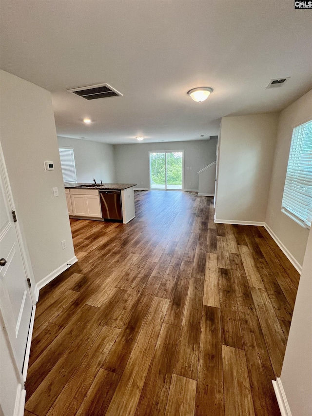 520 Cricket Chirp Ln, Elgin, SC 29045 - unfurnished living room with dark wood-style floors, a sink, and baseboards
