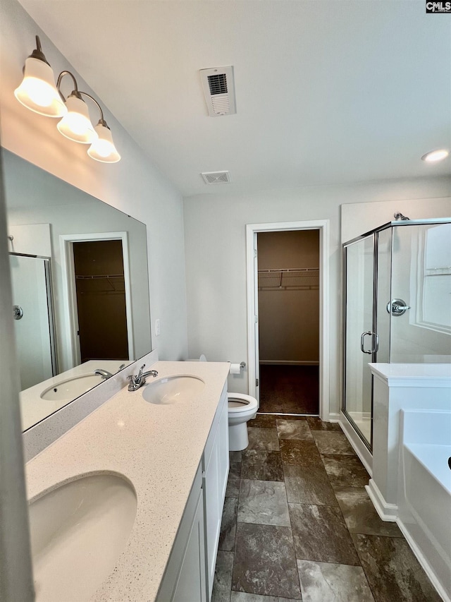 520 Cricket Chirp Ln, Elgin, SC 29045 - bathroom featuring a spacious closet, a stall shower, toilet, double vanity, and a bath