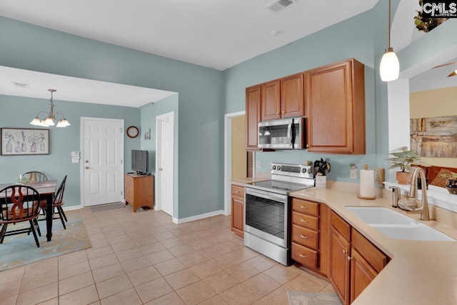121 Stonemont Dr, Irmo, SC 29063 - kitchen with stainless steel appliances, a sink, a chandelier, light countertops, and pendant lighting
