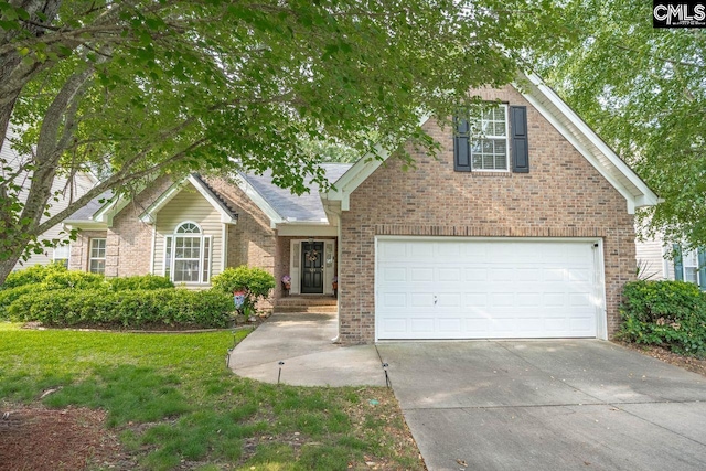 121 Stonemont Dr, Irmo, SC 29063 - traditional-style house featuring brick siding, concrete driveway, and a front lawn