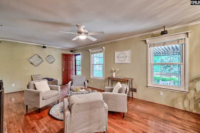 1108 Tarrytown Ln, West Columbia, SC 29170 - living room featuring plenty of natural light, light wood-type flooring, crown molding, and ceiling fan