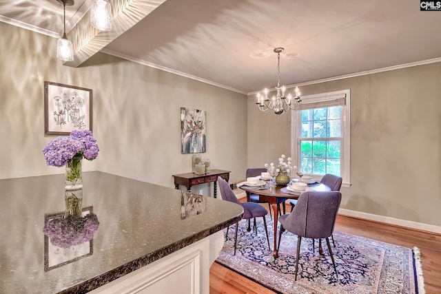 1108 Tarrytown Ln, West Columbia, SC 29170 - dining space featuring wood finished floors, a chandelier, crown molding, and baseboards