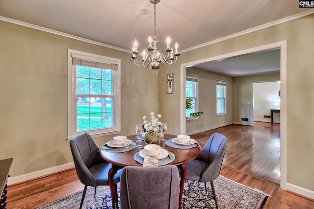 1108 Tarrytown Ln, West Columbia, SC 29170 - dining area with a chandelier, wood finished floors, ornamental molding, and baseboards