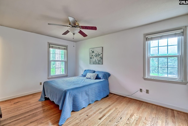 1108 Tarrytown Ln, West Columbia, SC 29170 - bedroom with wood finished floors, baseboards, and a ceiling fan
