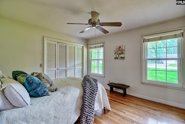 1108 Tarrytown Ln, West Columbia, SC 29170 - bedroom with light wood-type flooring, baseboards, a closet, and ceiling fan