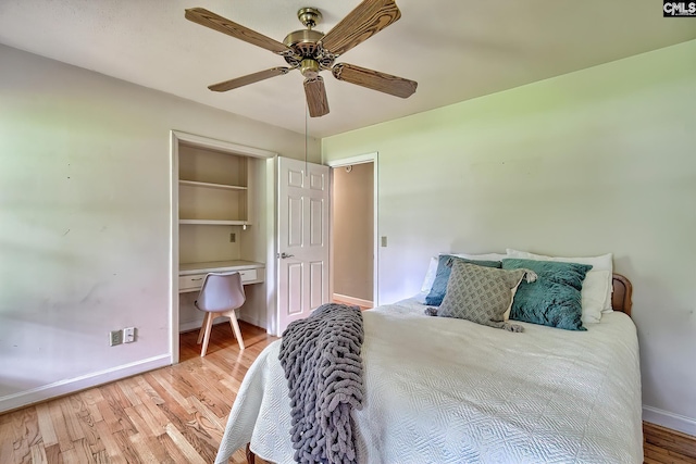 1108 Tarrytown Ln, West Columbia, SC 29170 - bedroom with wood finished floors, baseboards, an office area, ceiling fan, and a closet