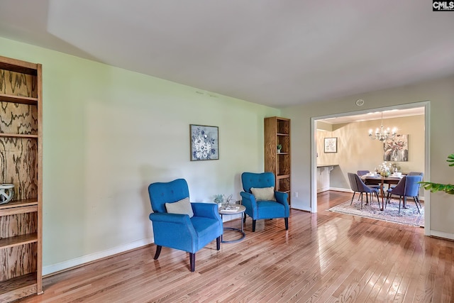 1108 Tarrytown Ln, West Columbia, SC 29170 - sitting room featuring wood-type flooring, a chandelier, and baseboards