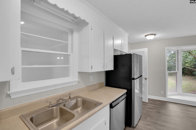 2136 Windale Dr, Columbia, SC 29223 - kitchen featuring stainless steel appliances, a textured ceiling, a sink, white cabinets, and light countertops