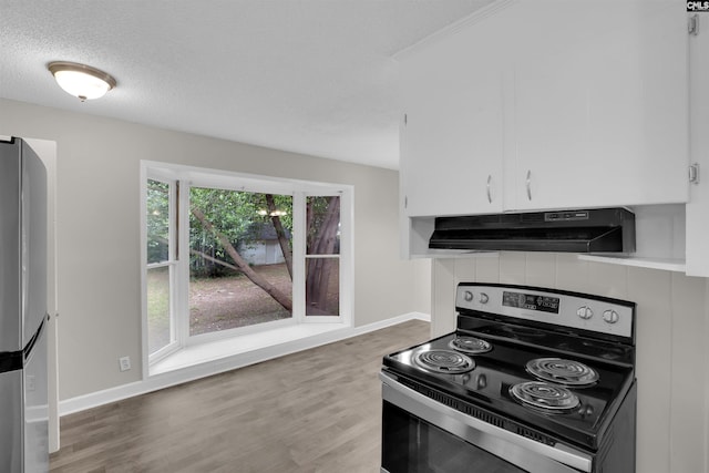 2136 Windale Dr, Columbia, SC 29223 - kitchen with stainless steel appliances, under cabinet range hood, wood finished floors, baseboards, and white cabinets