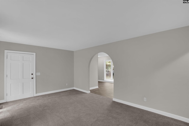 2136 Windale Dr, Columbia, SC 29223 - empty room with carpet floors, arched walkways, and baseboards