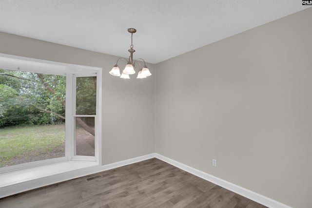 2136 Windale Dr, Columbia, SC 29223 - spare room with dark wood-style flooring, a chandelier, and baseboards