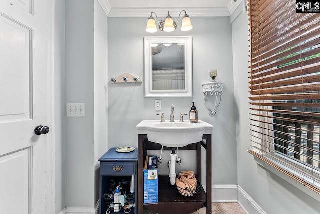 2909 Columbia Ave, Columbia, SC 29201 - bathroom featuring crown molding, baseboards, a sink, and tile patterned floors