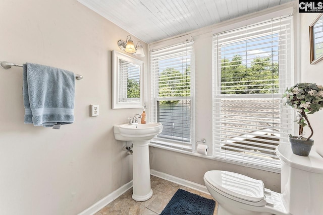 2909 Columbia Ave, Columbia, SC 29201 - half bath featuring plenty of natural light, tile patterned flooring, baseboards, and toilet