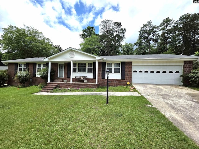 804 Dogwood St, Cayce, SC 29033 - single story home with concrete driveway, an attached garage, a porch, a front yard, and brick siding
