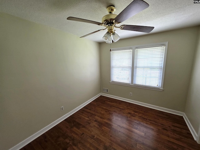 804 Dogwood St, Cayce, SC 29033 - spare room featuring dark wood finished floors, baseboards, ceiling fan, and a textured ceiling