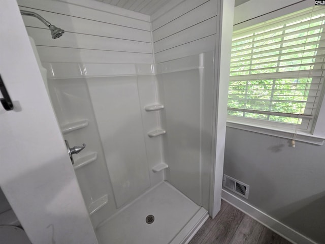 804 Dogwood St, Cayce, SC 29033 - bathroom featuring a stall shower, wood finished floors, and baseboards