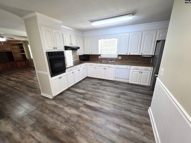 804 Dogwood St, Cayce, SC 29033 - kitchen with black appliances, white cabinets, a ceiling fan, ornamental molding, and a sink