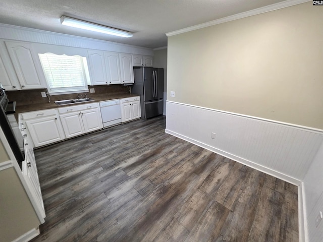 804 Dogwood St, Cayce, SC 29033 - kitchen featuring freestanding refrigerator, a sink, white dishwasher, dark countertops, and dark wood-style flooring