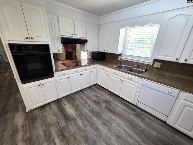 804 Dogwood St, Cayce, SC 29033 - kitchen featuring black appliances, under cabinet range hood, crown molding, dark countertops, and white cabinetry