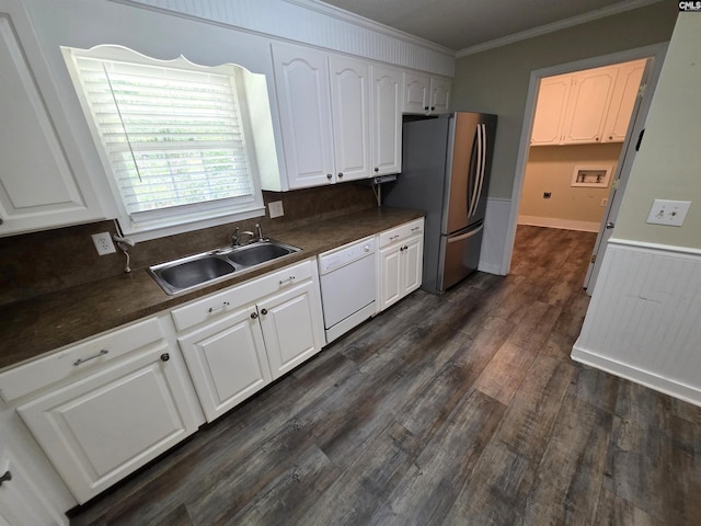 804 Dogwood St, Cayce, SC 29033 - kitchen featuring white dishwasher, a sink, dark countertops, ornamental molding, and freestanding refrigerator