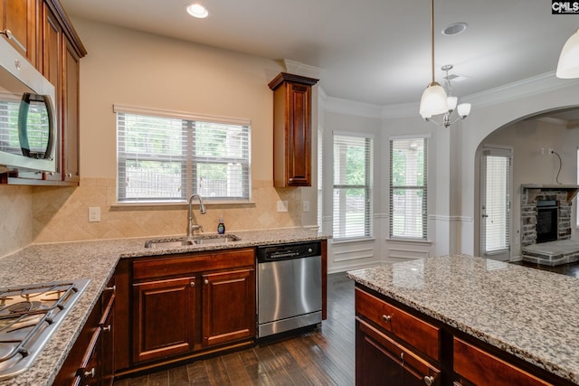 757 Garrett Way, Columbia, SC 29229 - kitchen featuring stainless steel appliances, a sink, dark wood-style flooring, arched walkways, and plenty of natural light