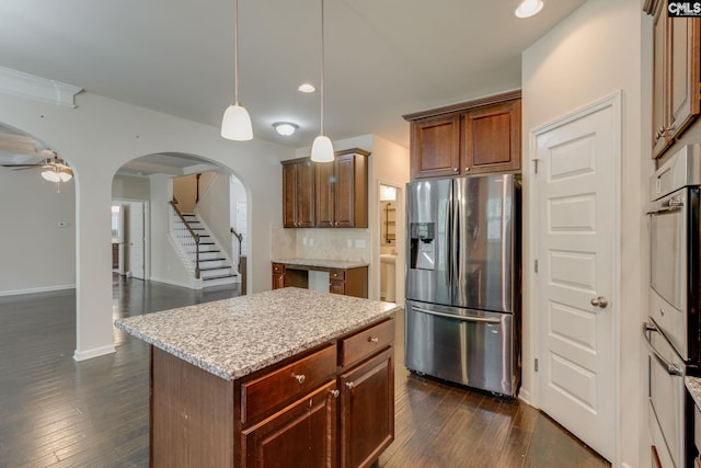 757 Garrett Way, Columbia, SC 29229 - kitchen with stainless steel refrigerator with ice dispenser, arched walkways, backsplash, dark wood-style flooring, and recessed lighting