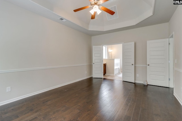 757 Garrett Way, Columbia, SC 29229 - unfurnished bedroom with a raised ceiling, dark wood-style flooring, baseboards, connected bathroom, and ceiling fan