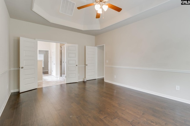 757 Garrett Way, Columbia, SC 29229 - unfurnished bedroom featuring wood finished floors, a raised ceiling, baseboards, and ceiling fan