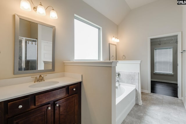 757 Garrett Way, Columbia, SC 29229 - bathroom with vaulted ceiling, a garden tub, vanity, and a shower