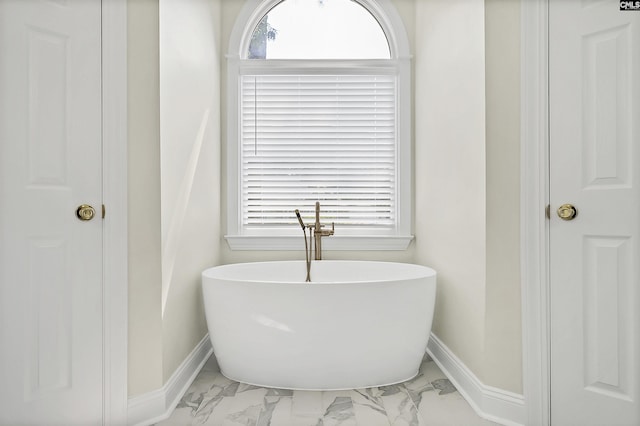 315 Poindexter Ln, Lexington, SC 29072 - full bathroom featuring marble look tile flooring, a soaking tub, and baseboards