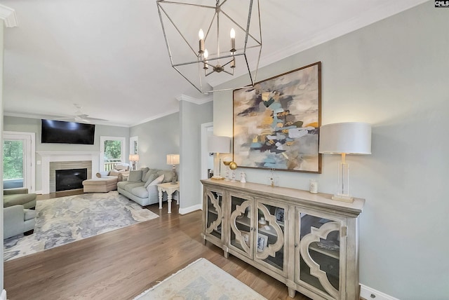 315 Poindexter Ln, Lexington, SC 29072 - living area featuring wood finished floors, ornamental molding, baseboards, a tile fireplace, and a chandelier