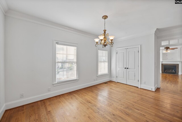 104 Eastshore Dr, Lexington, SC 29072 - unfurnished dining area featuring a chandelier, crown molding, baseboards, and light wood-type flooring
