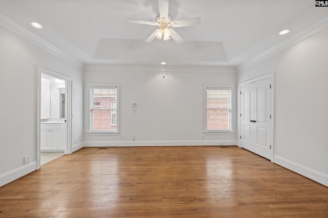 104 Eastshore Dr, Lexington, SC 29072 - spare room with a raised ceiling, a ceiling fan, light wood-style flooring, baseboards, and recessed lighting
