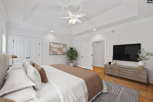 104 Eastshore Dr, Lexington, SC 29072 - bedroom featuring a tray ceiling, recessed lighting, wood finished floors, ornamental molding, and a ceiling fan