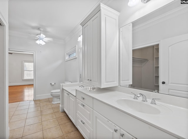 104 Eastshore Dr, Lexington, SC 29072 - bathroom with ornamental molding, double vanity, toilet, a ceiling fan, and tile patterned floors