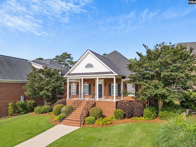 104 Eastshore Dr, Lexington, SC 29072 - greek revival inspired property with stairs, brick siding, a front yard, and covered porch