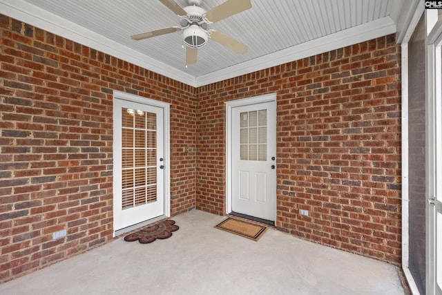 104 Eastshore Dr, Lexington, SC 29072 - view of exterior entry featuring a ceiling fan, brick siding, and a patio area