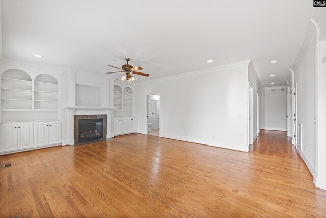 104 Eastshore Dr, Lexington, SC 29072 - unfurnished living room with crown molding, a ceiling fan, a fireplace, light wood-style floors, and baseboards