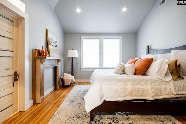 2808 River Dr, Columbia, SC 29201 - bedroom with lofted ceiling, light wood-style flooring, baseboards, and recessed lighting