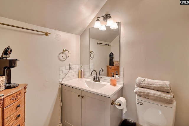 205 Weeping Cherry Ln, Columbia, SC 29212 - bathroom featuring vanity, tasteful backsplash, toilet, and lofted ceiling