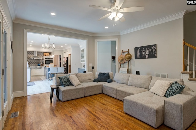 108 Shallow Brook Dr, Columbia, SC 29223 - living room with ceiling fan, light wood-style floors, a chandelier, stairs, and recessed lighting
